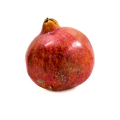 Whole pomegranate isolated on white background