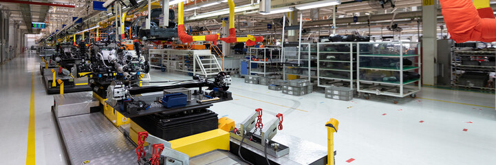 Automotive production line. Long format. Wide angle view of plant of automotive industry. Can be...