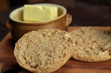 A half-cut roll of graham on a wooden board