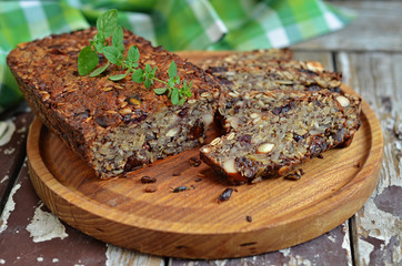 Bread gluten-free with seeds on a wooden board