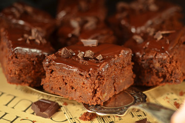 A piece of chocolate cake with chocolate icing