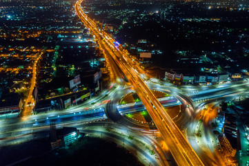 Fototapeta na wymiar Aerial view of traffic in roundabout and highway at night.