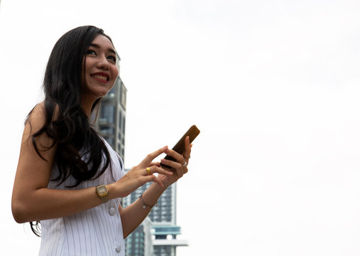 Beautiful woman smile portrait and talking mobile phone device. blur and retouch mobile phone device.