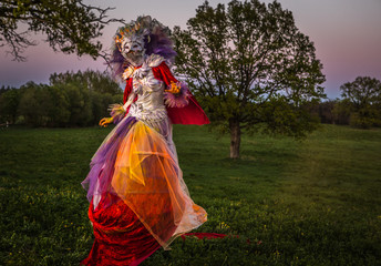Obraz na płótnie Canvas Fairy tale woman on stilts in bright fantasy stylization. Fine art outdoor photo. 