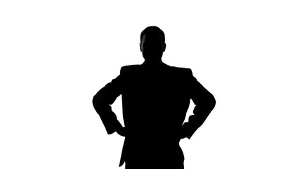 Silhouette of businessman holding hands on his hip, seriousness of intentions