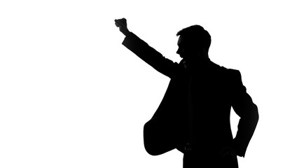 Man silhouette raising fists up, celebrating victory, good bargain, side view