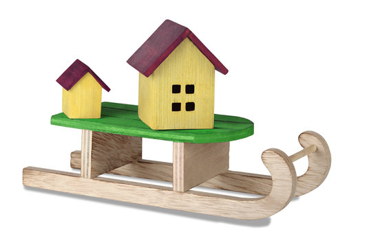 The concept of housing in the new year. House  on sledding.
