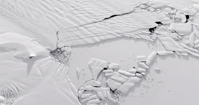 Very high-altitude circular tracking shot Pine Island Glacier after Iceberg B-46 calving. Reversible, seamless loop. Elements of this image furnished by NASA. 