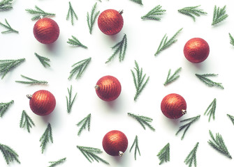 Christmas celebration concepts with pine branch and red ball  ornament on white background.