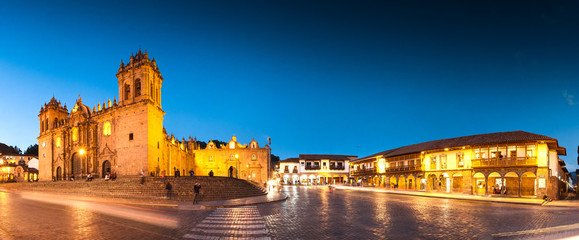 Cuzco, Peru: Panoramic view of Cathedral church and city at night. - obrazy, fototapety, plakaty