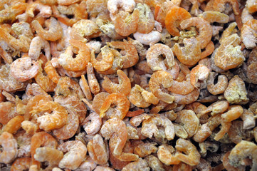 Dried shrimps presented at market stall in Chinese city.