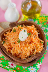 Fresh carrot salad with grated carrots, grated cheese and mayonnaise