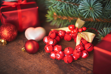 Christmas background. A lot of red vintage baubles, gift box and fir tree