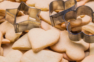Tasty homemade cookies of different shapes - heart, moon, star, flower, rhombus - baked for Christmas