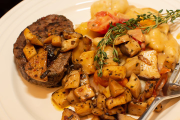 Single serving steak and mushrooms on plate ready to eat conceptual eating in moderation