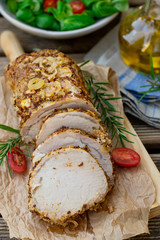 Roast pork loin in mustard marinade with rosemary