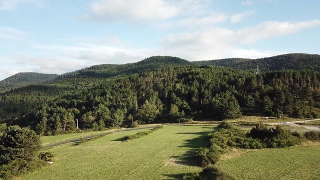 Aerial view of forest and meadow in pyrenean countryside, Aude region of France