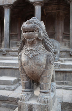Ancient stone statue of Lion guard at Durbar Square in Patan, Nepal