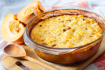 Baked milky cereal porridge with pumpkin and raisins