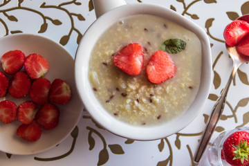 Homemade porridge with strawberries