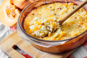 Baked milky cereal porridge with pumpkin and raisins
