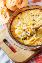 Baked milky cereal porridge with pumpkin and raisins