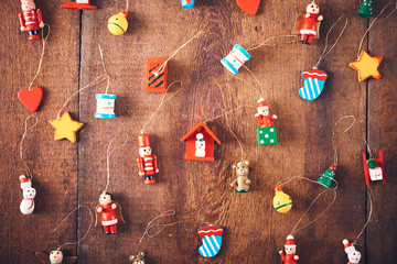 Christmas background. Set with a lot of different colorful tiny toys over dark wooden board