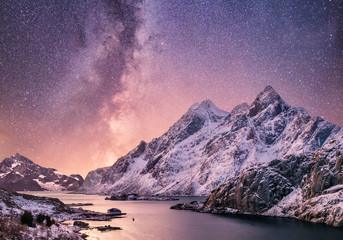 Mountans and reflection on the water surface at the night time. Sea bay and mountains at the night time. Milky way above mountains, Norway. - obrazy, fototapety, plakaty