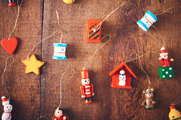 Christmas background. Set with a lot of different colorful tiny toys over dark wooden board