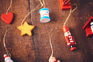 Christmas background. Set with a lot of different colorful tiny toys over dark wooden board