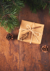  gift boxes, fir tree and decoration on wooden background. Christmas concept