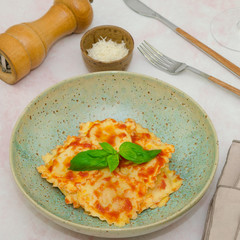 Ravioli. Ravioli with tomato sauce and parmesan