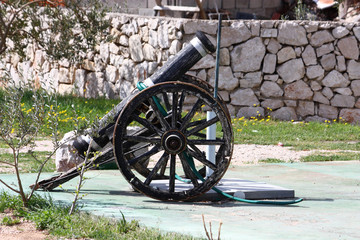 Old cannon made of wood and iron