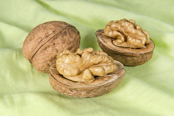 Walnuts on light green cloth