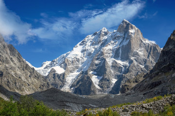 Two headed mountain Ushba in Georgia. Svaneti covered with snow and ice even in summer