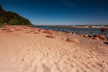 sea beach skyline with clouds and calm water
