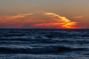 sea beach skyline with clouds and calm water