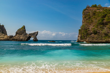 Magnificent view of unique natural rocks and cliffs formation in beautiful beach known as Atuh Beach located in the east side of Nusa Penida Island, Bali, Indonesia.