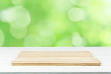 Mock-up of organic outdoor cooking or product presentation- empty wooden plank on the table (mixed)