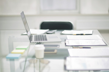 laptop and clipboard on the desktop in the office.photo with copy space