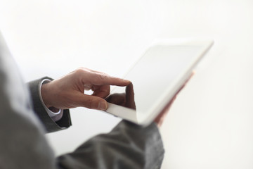 close up.the businessman's hand presses on the screen of a digit