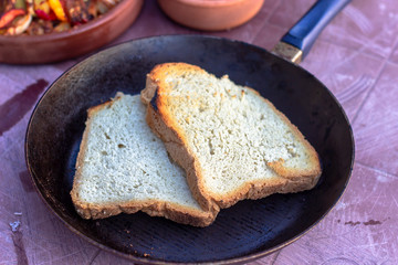 Close-up shoot of traditional homemade bread on fry-pan