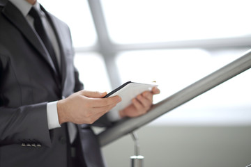 Close-up Of Businessman Looking At Digital Tablet