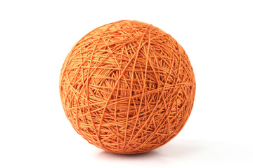 Orange big thread ball isolated on white background. Ball of natural cotton string.