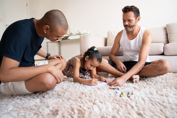 Gay Couple Helping her Daughter Doing Homework 