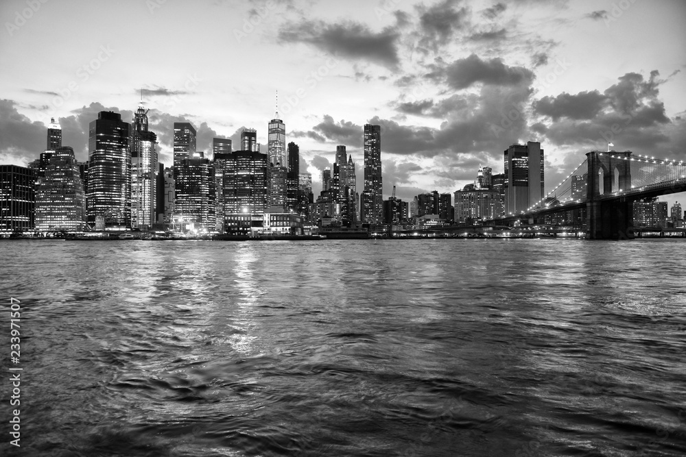 Sticker New York cityscape at night. New York City, financial district in lower Manhattan view from Brooklyn Bridge Park.