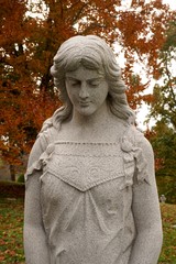 Fototapeta premium tombstones with angels and figures in victorian graveyard