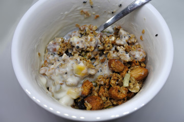 Granola Yogurt Breakfast in white bowl close-up