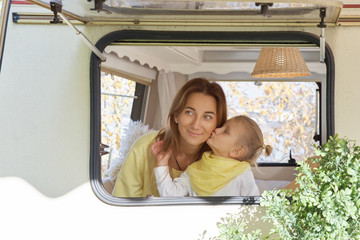 Love, family, relationships. The child kisses mother gently on the cheek