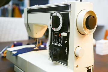 White sewing-machine in a tailor´s atelier